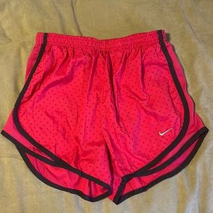 Nike pink with purple detail and polka dots.  Dri-fi and fully lined.